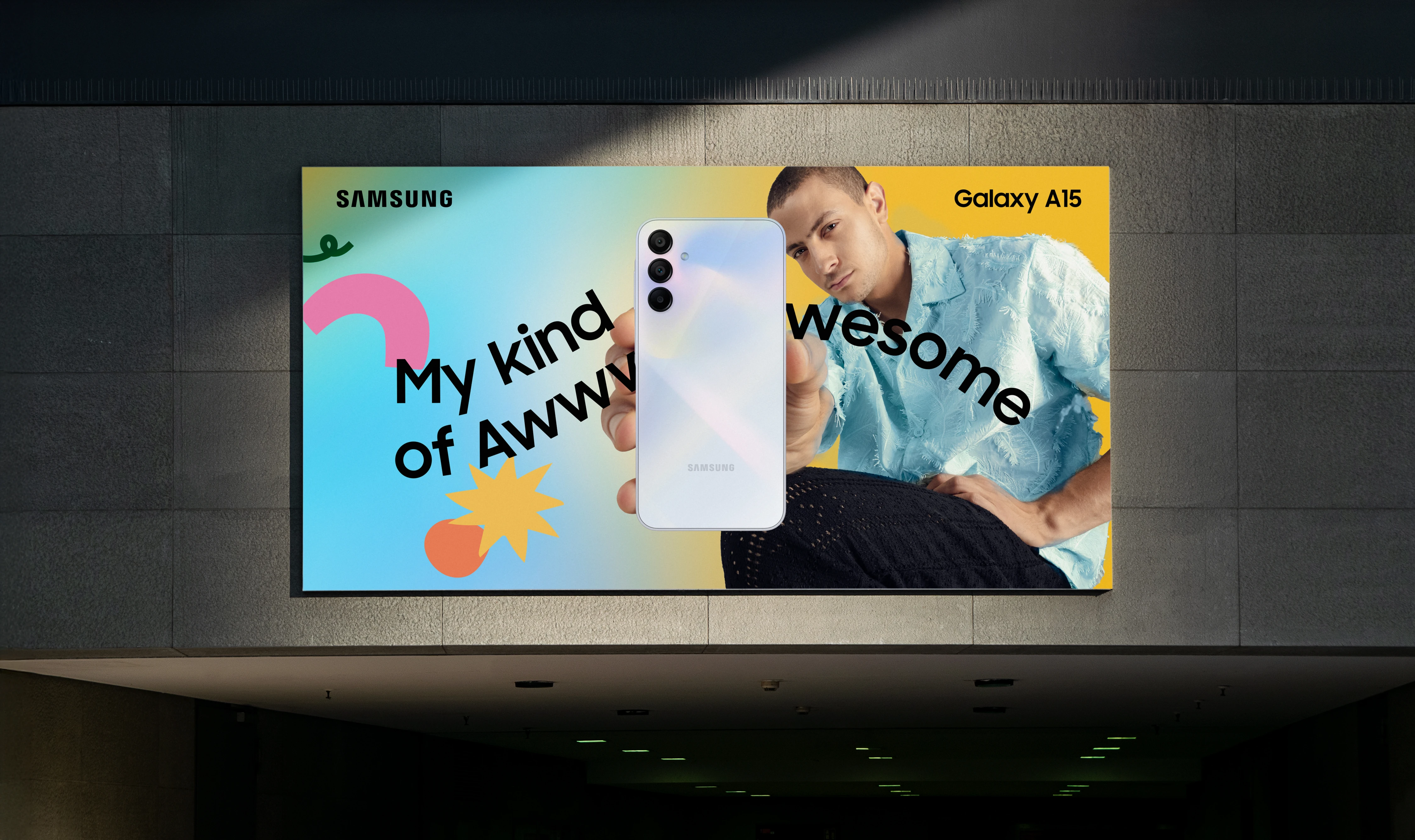 Galaxy A15 My Kind of Awesome campaign displayed on a billboard above an underground passage
