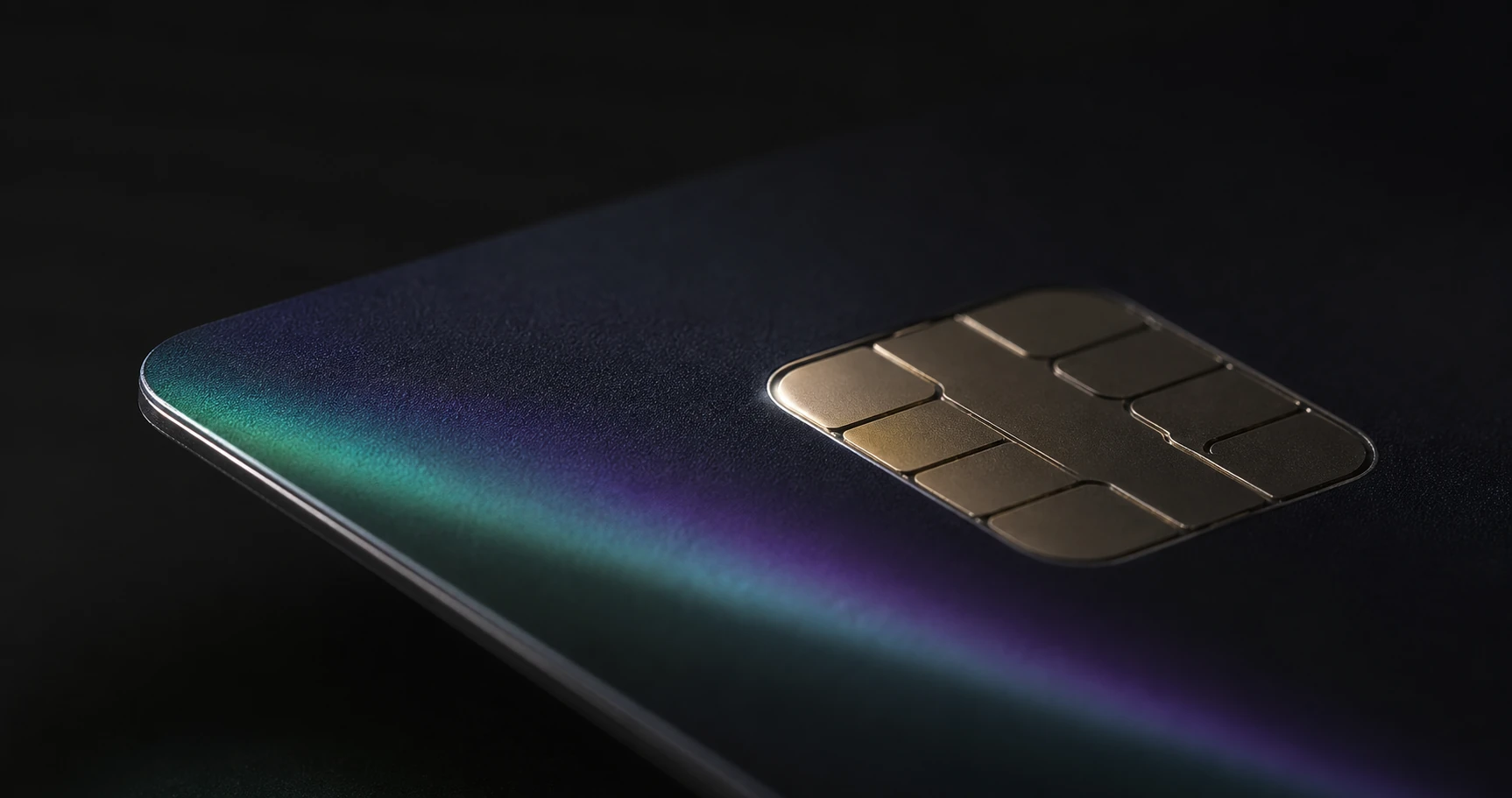 Macro view of a premium dark payment card and metallic chip
